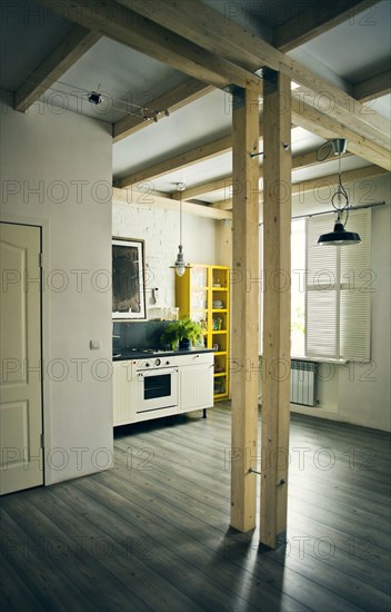 Wooden beams in loft kitchen
