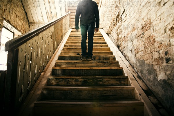 Mari man standing on staircase