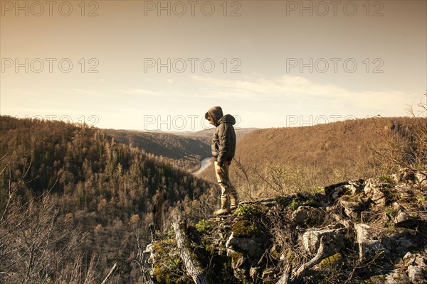 Mari man overlooking rural landscape