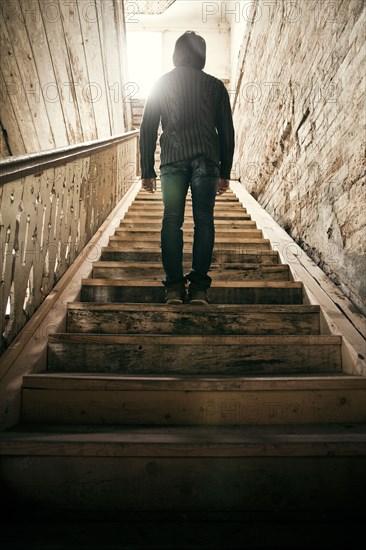 Mari man standing on staircase