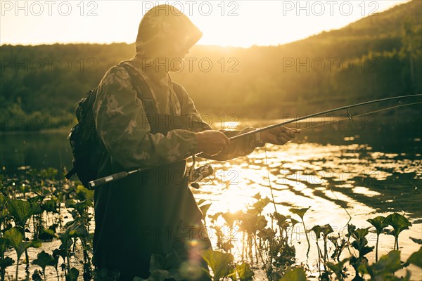 Mari man fishing in lake