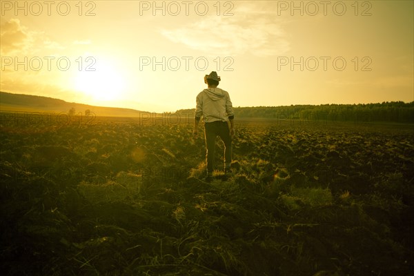 Mari man standing in rural field