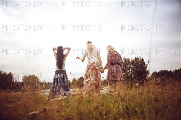 Caucasian women standing in field