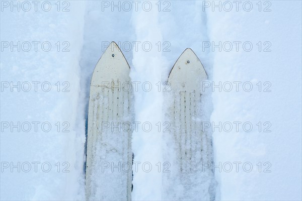 High angle view of skis making tracks in snow
