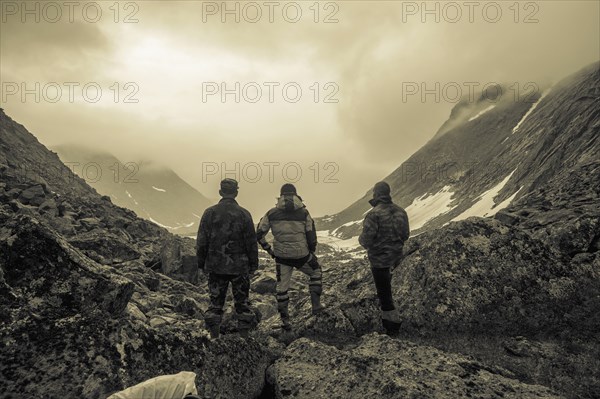 Hikers admiring mountain valley