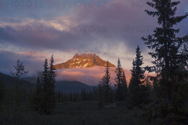 Mountain and clouds in remote landscape