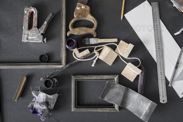 Picture frame and tools on table