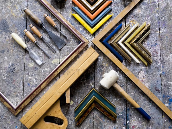 Picture frame tools on splattered table
