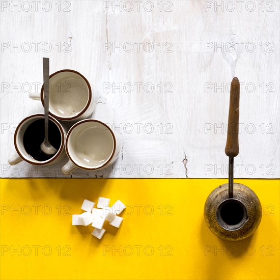 Coffee and sugar on table