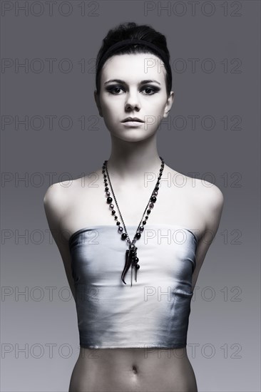 Portrait of serious Caucasian woman wearing necklace