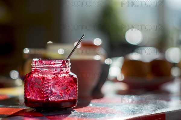 Spoon in jar of jam