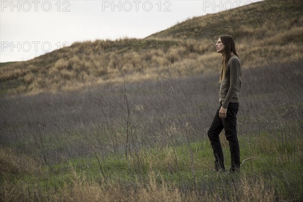 Man walking in rural field