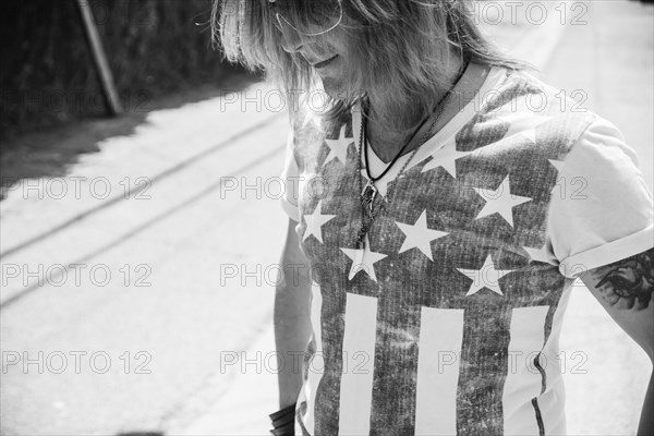 Caucasian man wearing American flag shirt