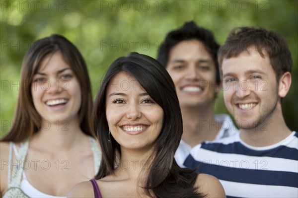 Friends smiling outdoors