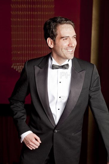 Elegant Hispanic man in tuxedo