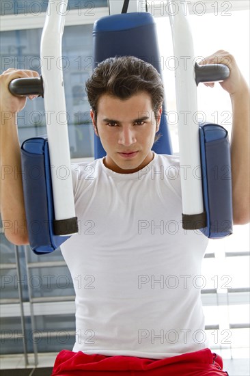 Hispanic man working out in health club