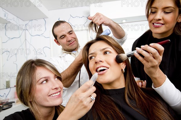 Hispanic woman having beauty treatments in salon