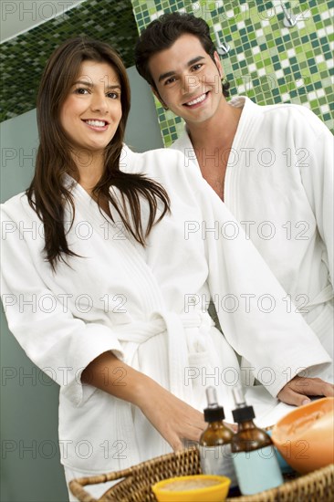 Hispanic couple wearing bathrobes