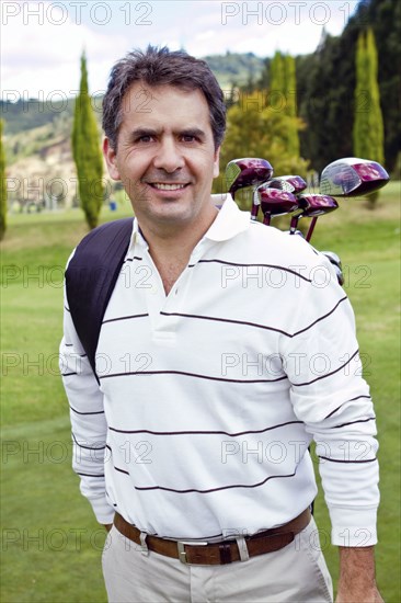 Hispanic man playing golf