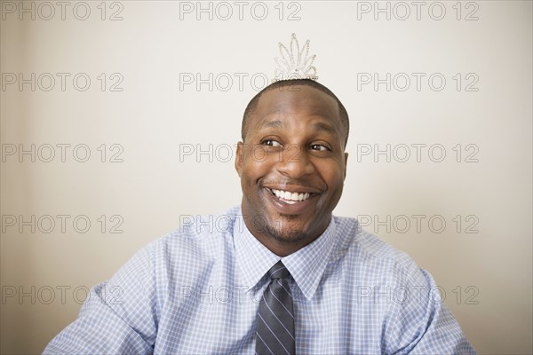 African man wearing tiara