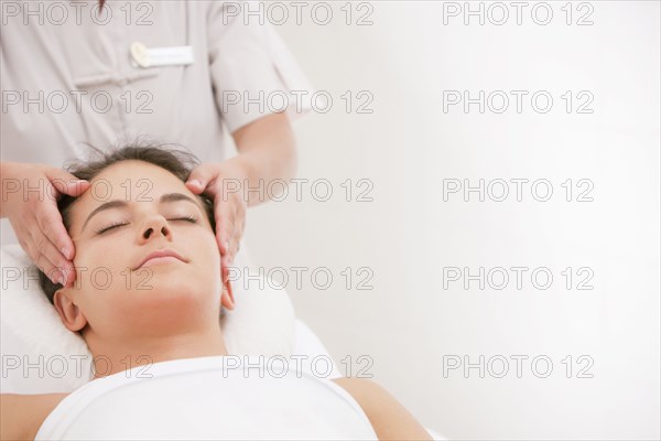 Woman having facial massage