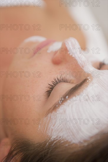 Woman having facial spa treatment