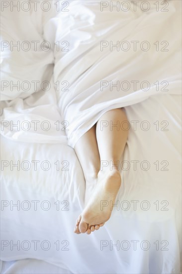 Woman's feet in bed