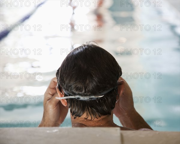 Man swimming in swimming pool