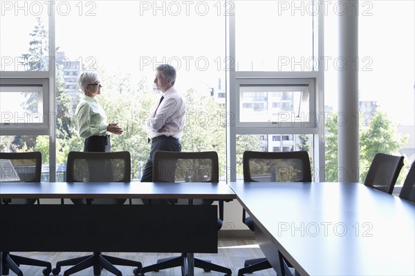 Caucasian business people talking in conference room