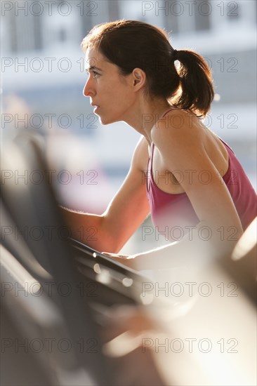 Woman exercising in health club