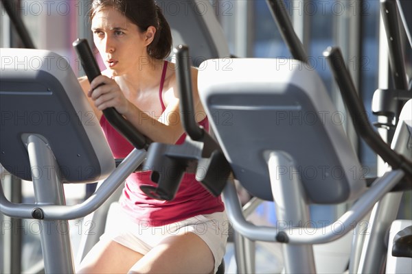 Woman exercising in health club