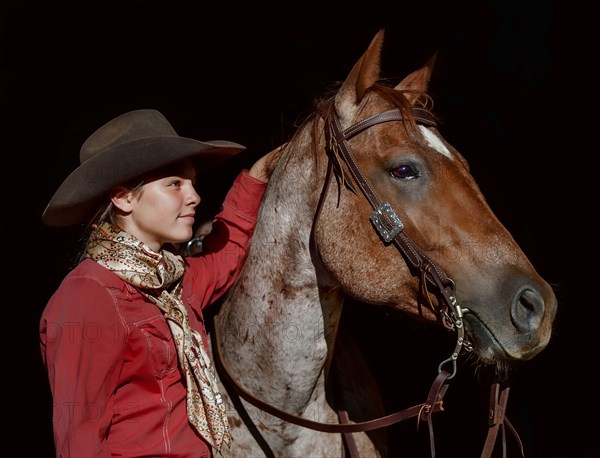 Portrait of Caucasian girl posing with horse