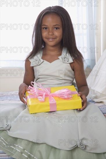 African American girl holding gift