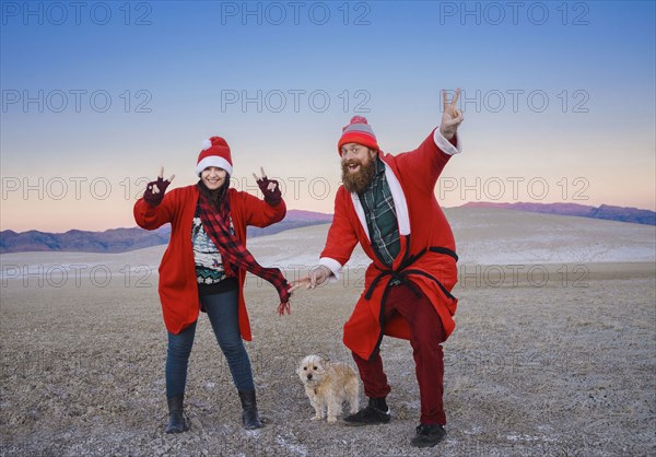 Festive couple celebrating Christmas in the desert