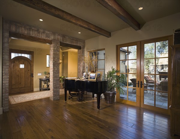 Entrance foyer with beamed ceiling and grand piano