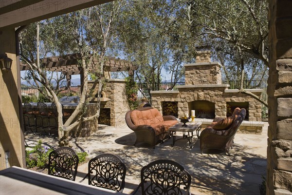 View over backyard bar to sitting area near fireplace