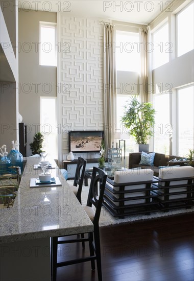 Contemporary loft interior with breakfast bar and living room