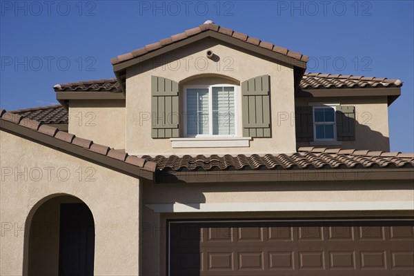 Front exterior stucco home with garage