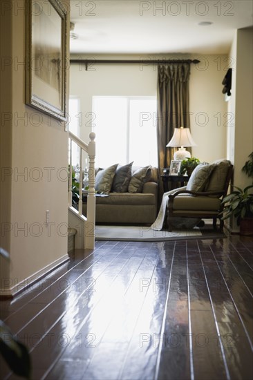 Hardwood hallway leading to living room