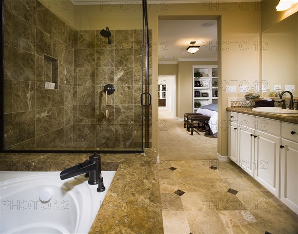 Master bathroom with large tub and glass shower