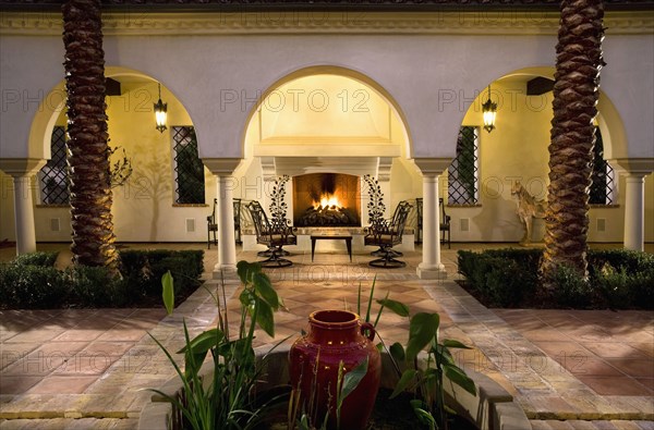 Sitting area with fireplace in courtyard