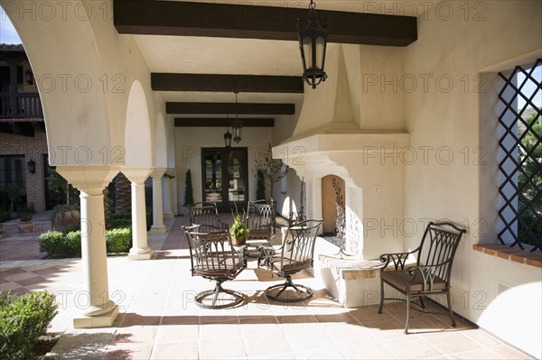 Sitting area near fireplace in outdoor corridor