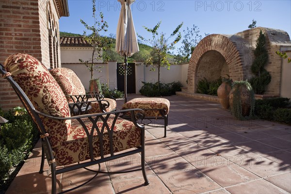 Side terrace with large brick fire place