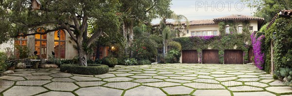 Grass driveway in front of home