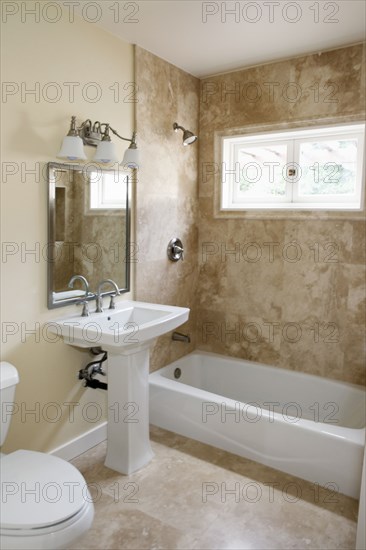 Pedestal sink in bathroom