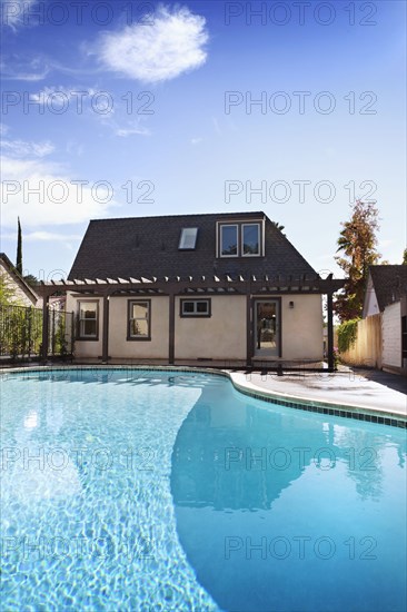 Exterior view of bungalow with swimming pool