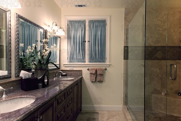 His and her sinks in contemporary bathroom