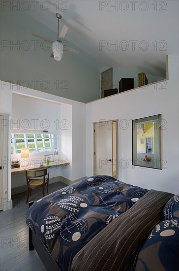 Bedroom with study table at the window