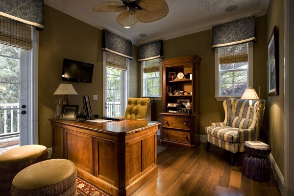 Large wooden desk in elegant home office