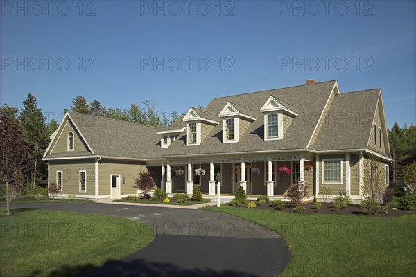 Curving driveway in front of single family home